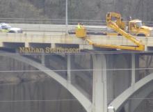 Washington street bridge inspection person on yellow boom truck